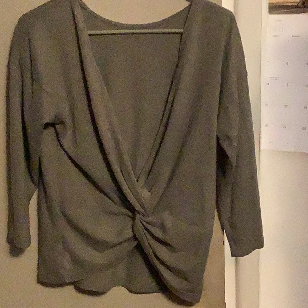 Front knot sweater grey in color.